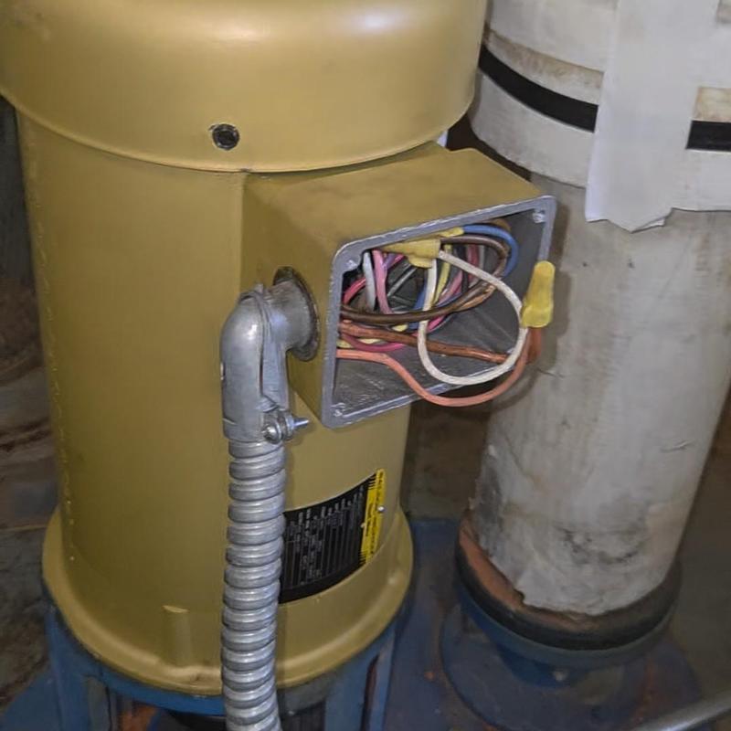 Cooling tower pump motor wiring connection close-up