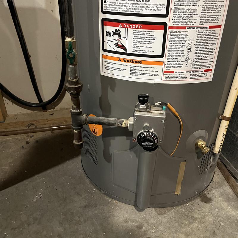 Gas water heater control valve and piping in basement