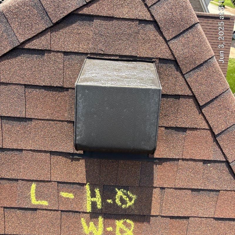 Roof shingles with hail and wind damage markings