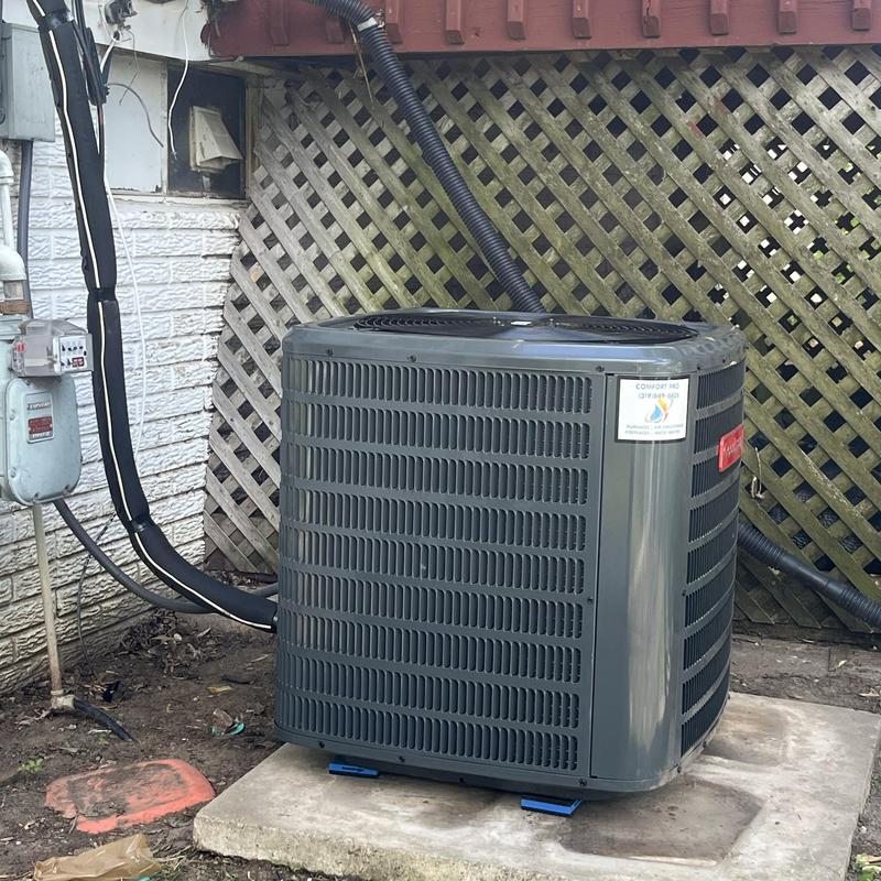 Air conditioner system installed on concrete pad
