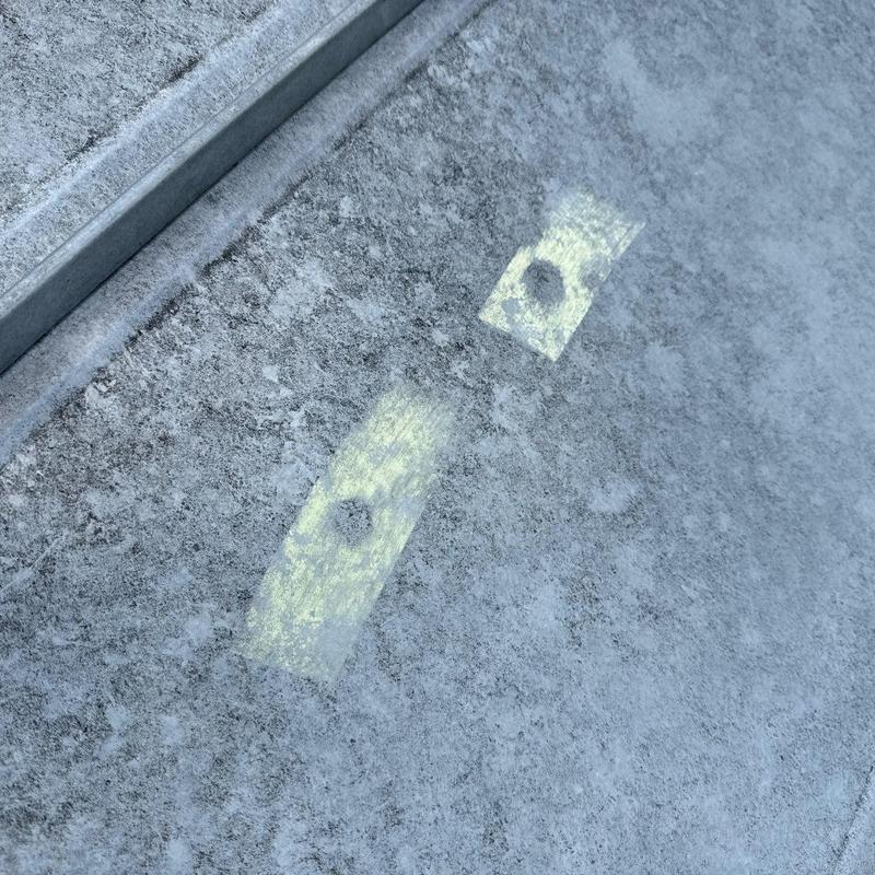 Metal roof panels with hail damage markings