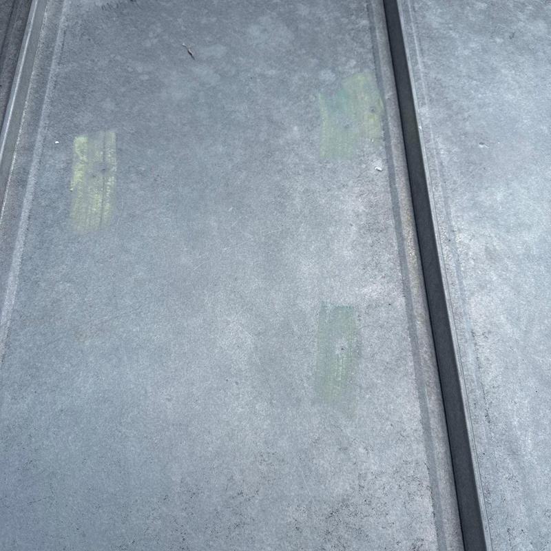 Metal roofing panels with minor hail damage marks