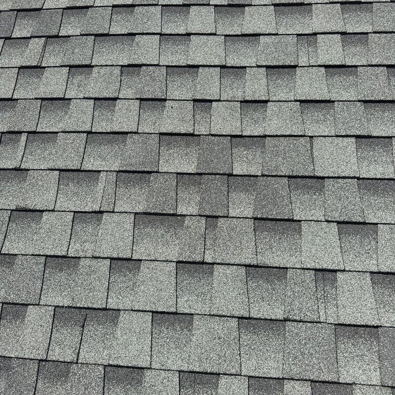 Architectural shingles with hail damage on roof