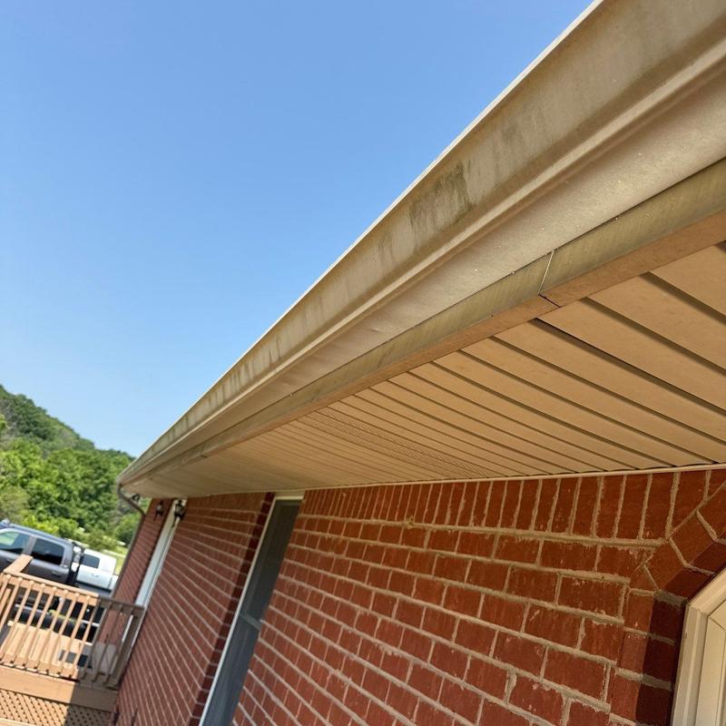 Gutter system with dirt and water stains on trim