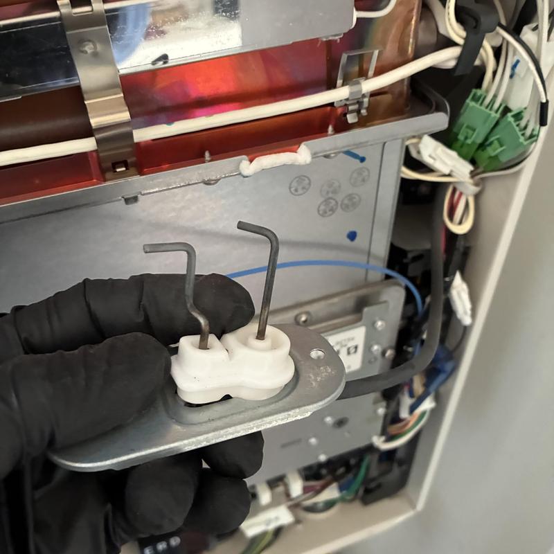 Tankless water heater igniter removal and inspection