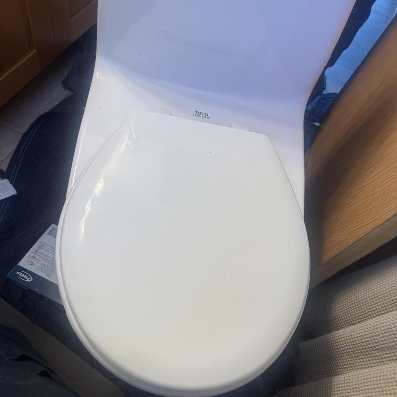 Toilet with new wax ring and fill valve installation