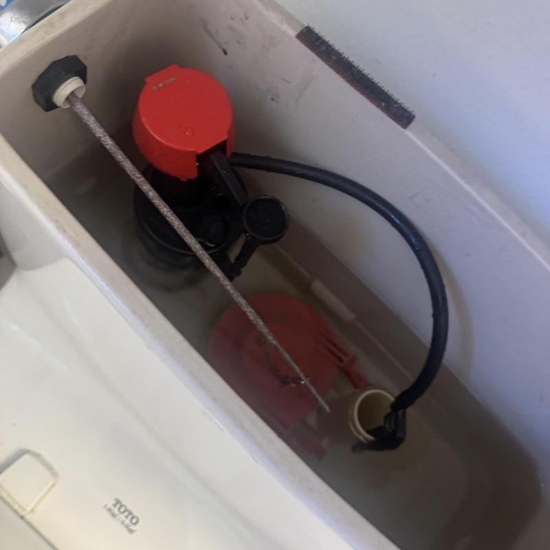 Toilet fill valve and flush mechanism inside tank