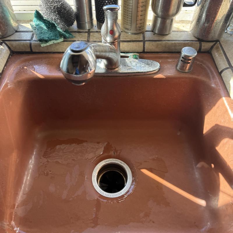 Kitchen sink drain cleared and cleaned, water running