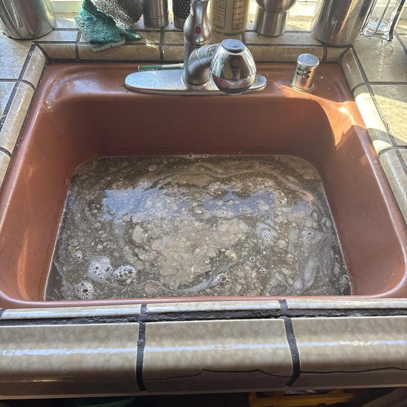 Kitchen sink drain with standing dirty water