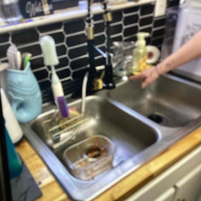 Double stainless steel kitchen sink with black faucet installation