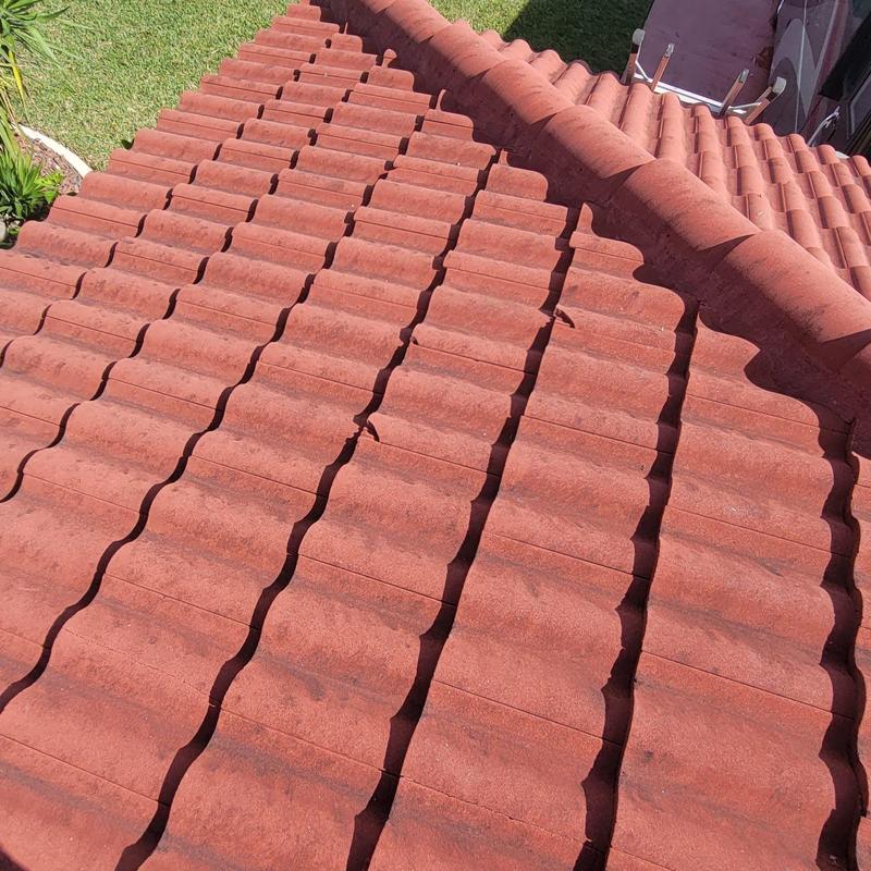 Concrete tile roof with cracked and failing repairs