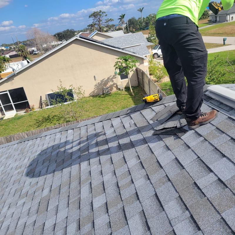 Shingle roof with loose and damaged shingles repair