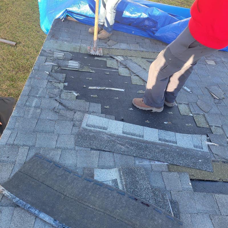Shingle roof removal and repair on damaged roof section