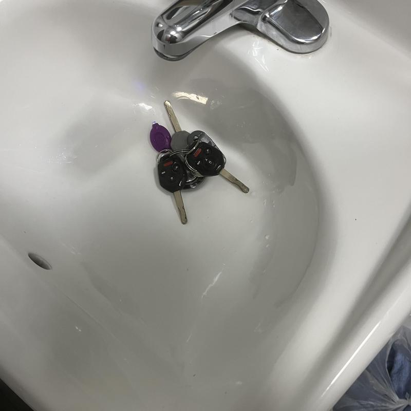 Toilet bowl with removed car keys inside Toilet bowl with removed car keys inside