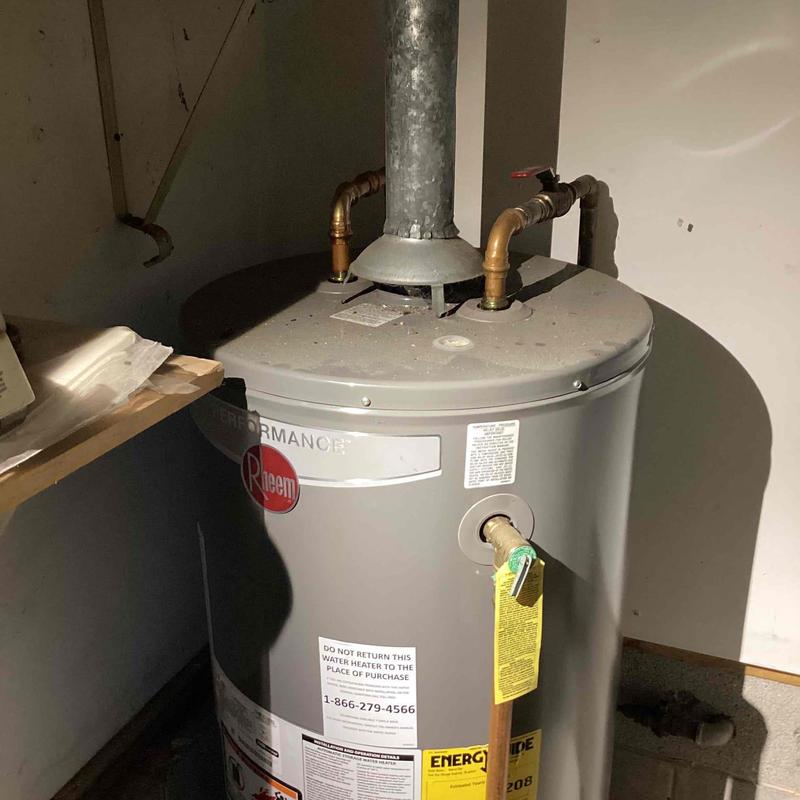 Gas water heater with vent and piping