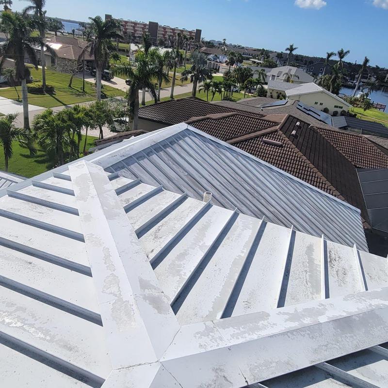 Standing seam metal roof with sealant repairs