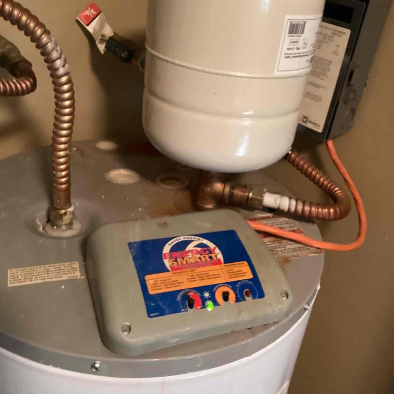 Expansion tank and water heater connection with piping