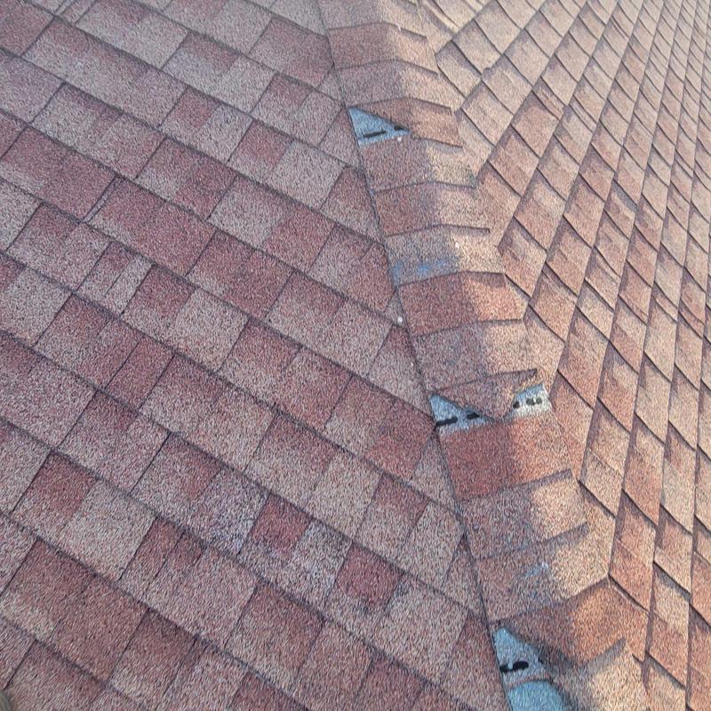 Shingle roof with missing or loose cap shingles