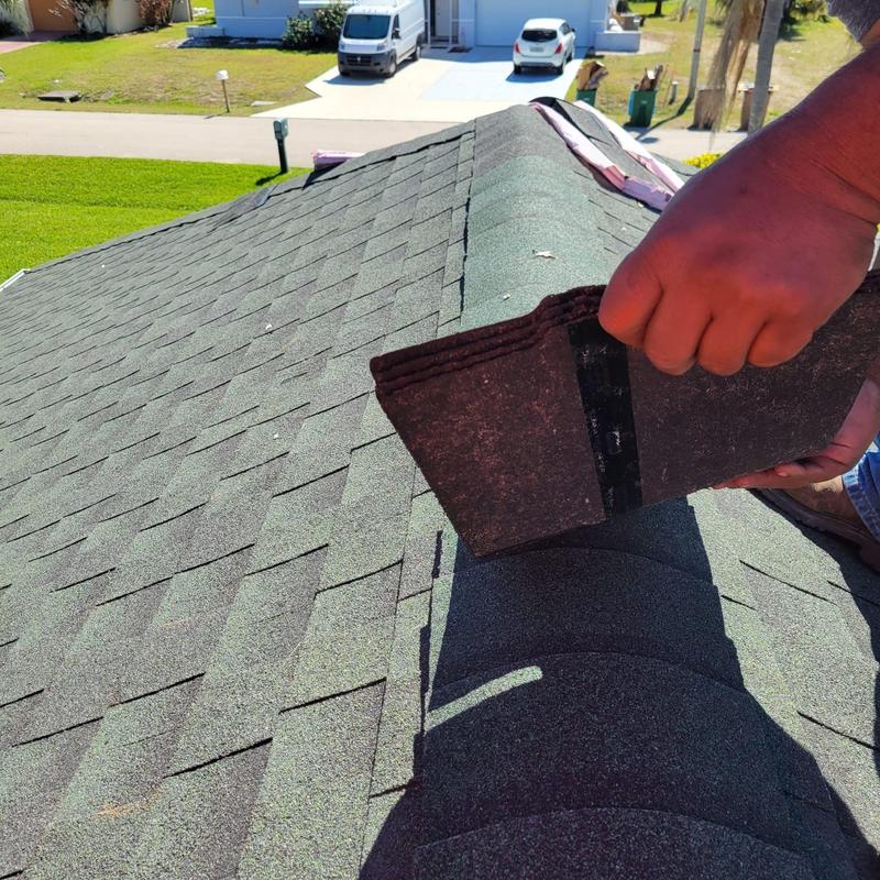 Cap shingles on ridge of asphalt shingle roof