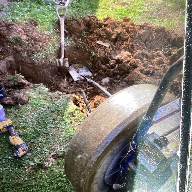 Sewer line excavation and cleaning with drain snake tool