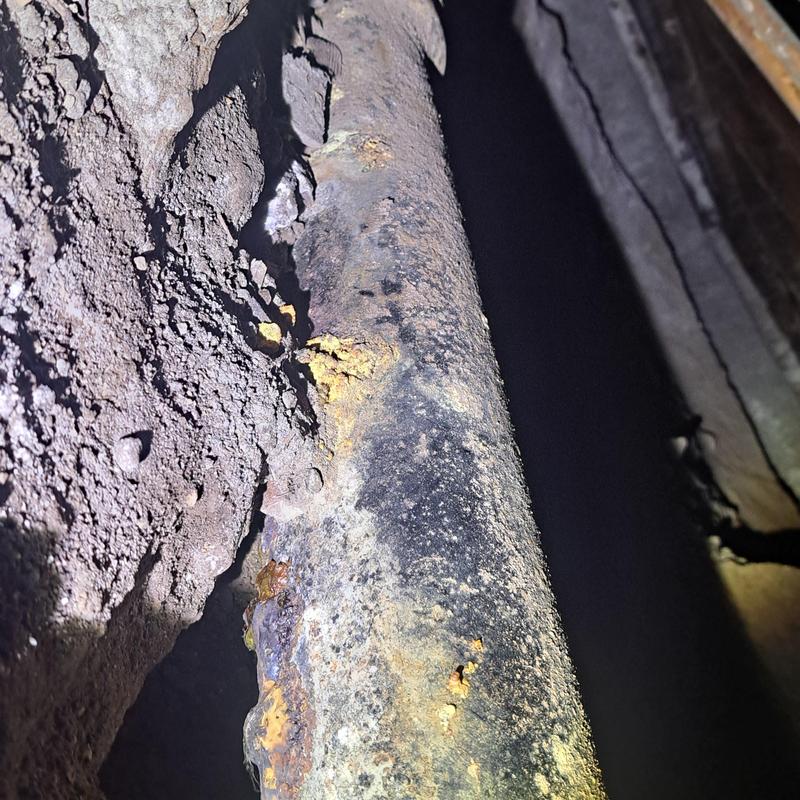 Cast iron drain pipe corrosion under house in Alhambra