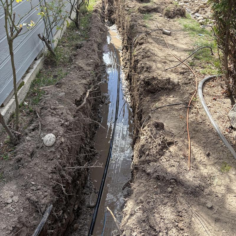 Watermain trench excavation with new pipe installation Watermain trench excavation with new pipe installation