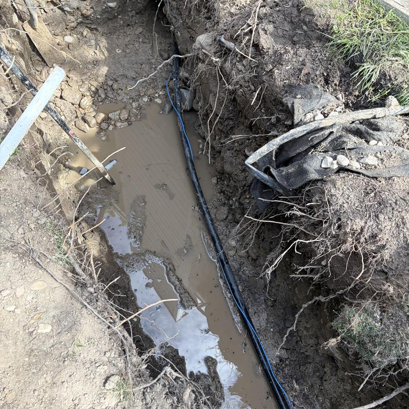 1 inch watermain installation in muddy trench excavation 1 inch watermain installation in muddy trench excavation