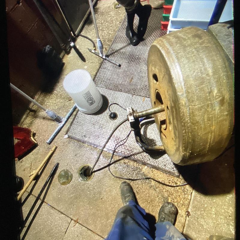 Drain jetting machine with hose in floor drain