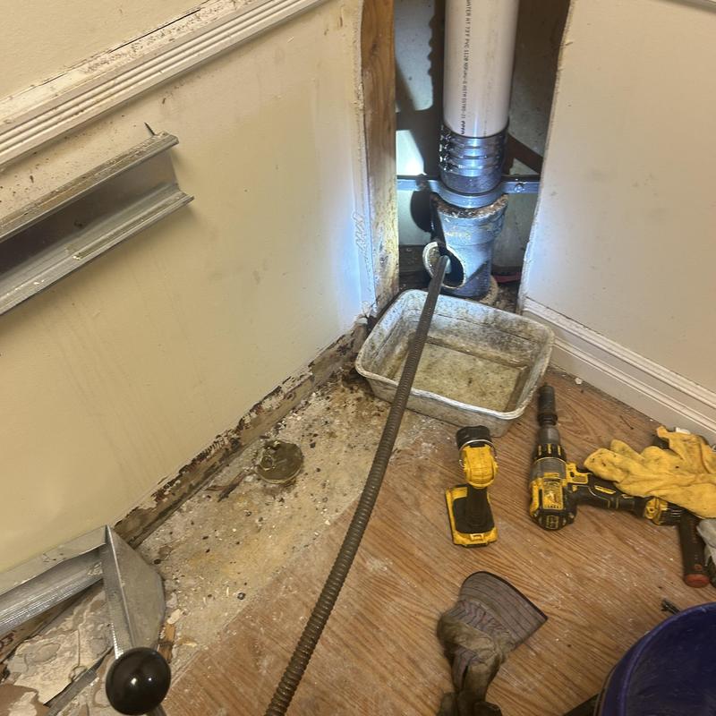 Main line sewer pipe with inspection snake and tools Main line sewer pipe with inspection snake and tools