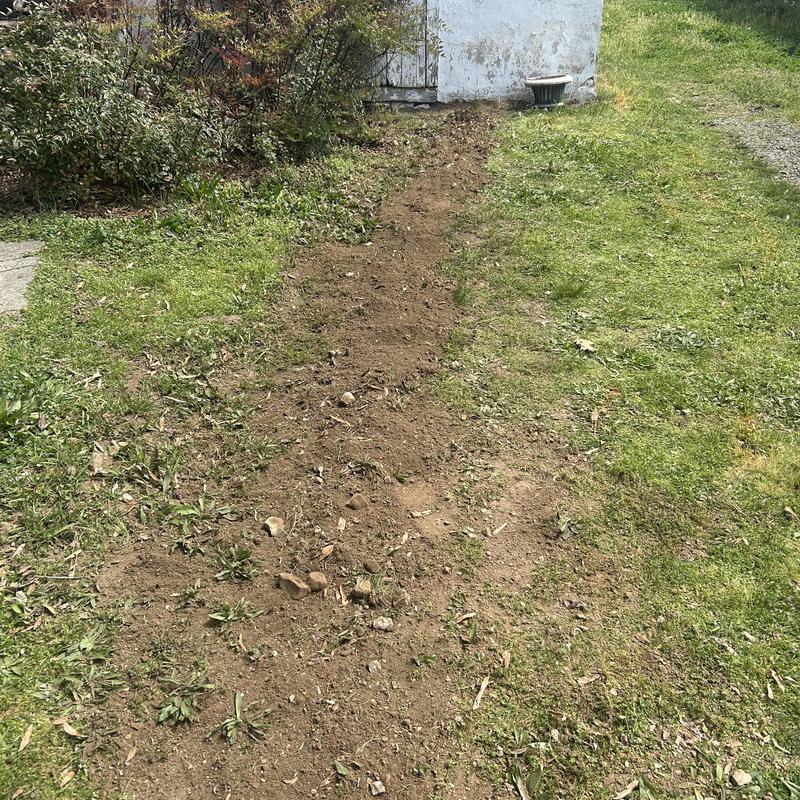 Galvanized water service pipe trench in yard Galvanized water service pipe trench in yard