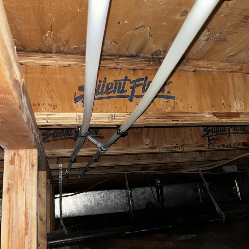 Pex piping installed in crawl space with supports