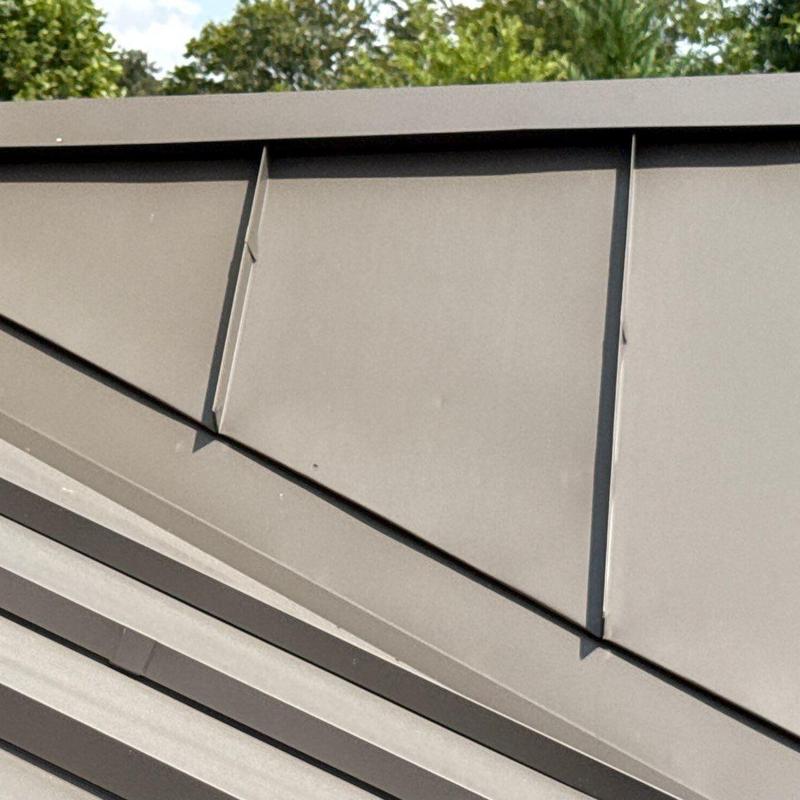 Metal roof panel with dent and seam damage