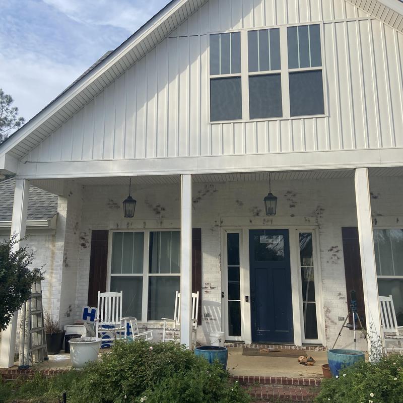 Front porch posts with new wrapped boards installed