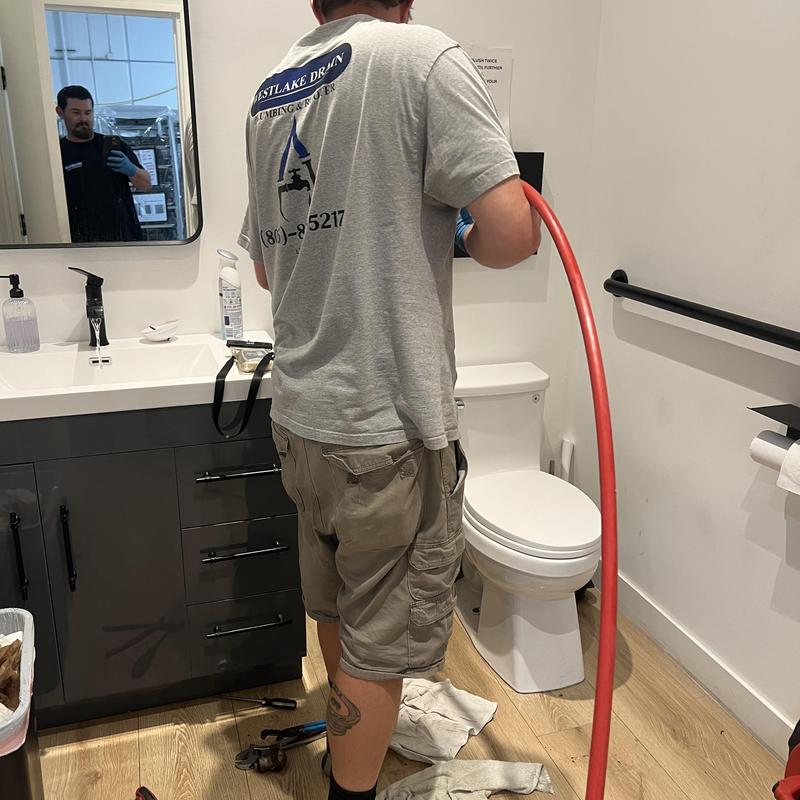 Main sewer line hydro jetting in bathroom restroom