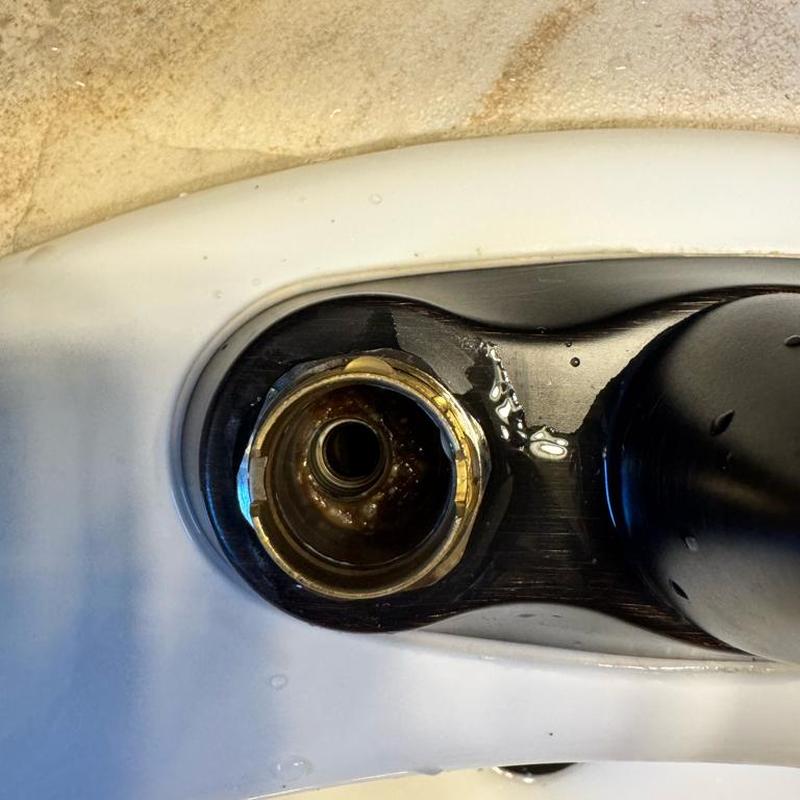 Bathroom faucet cartridge removed showing valve stem Bathroom faucet cartridge removed showing valve stem