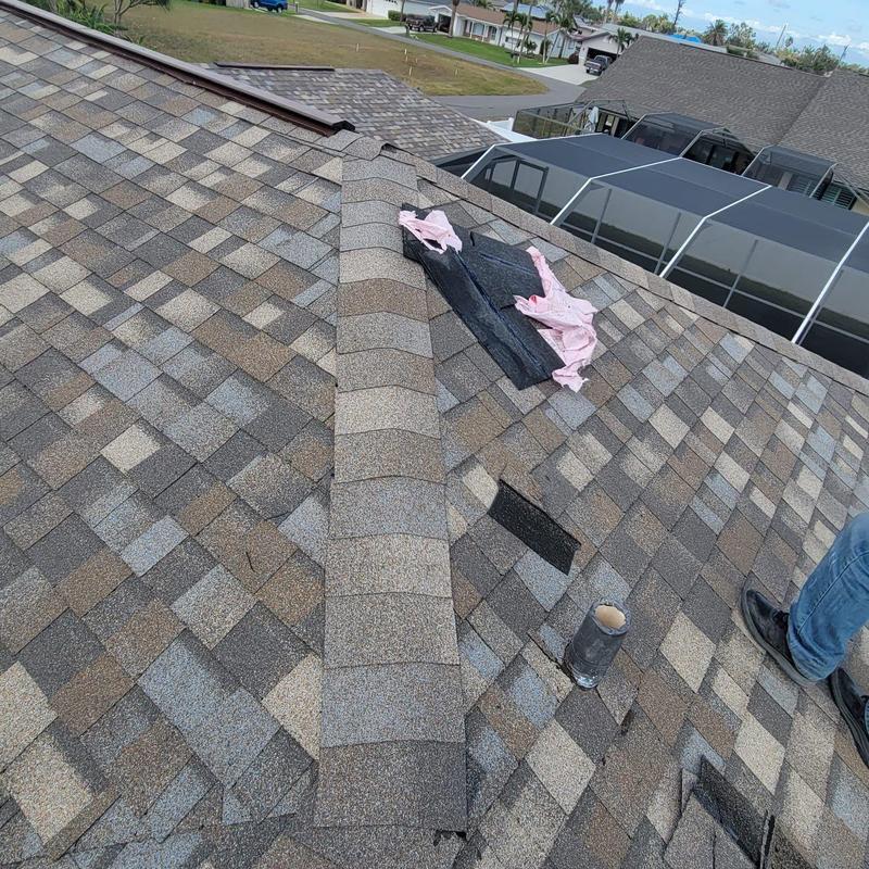 Hip cap shingles on shingle roof with repair materials