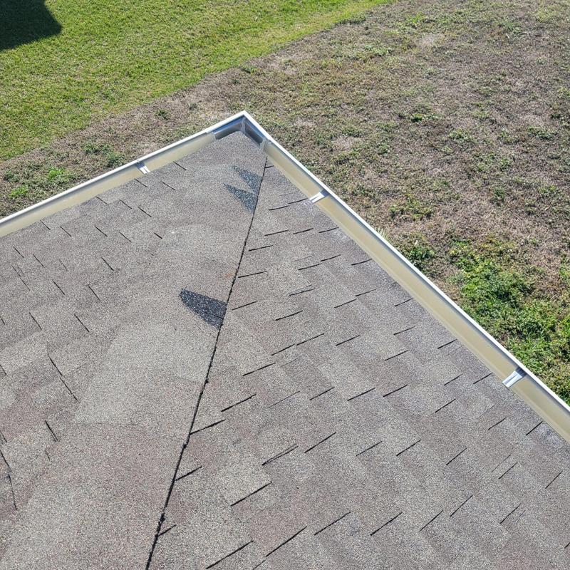 Hip cap shingles on shingle roof with gutter edge