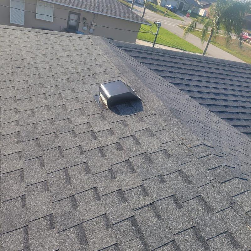 Roof vent and shingle roofing on residential house