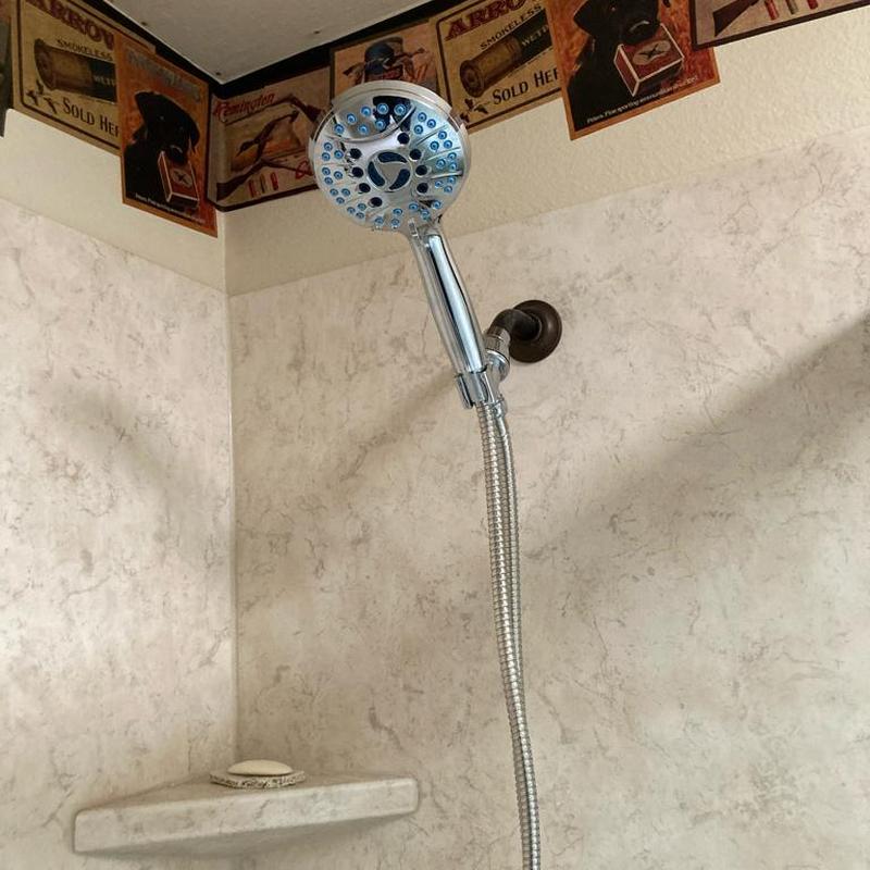 Handheld shower head with new shower arm installed