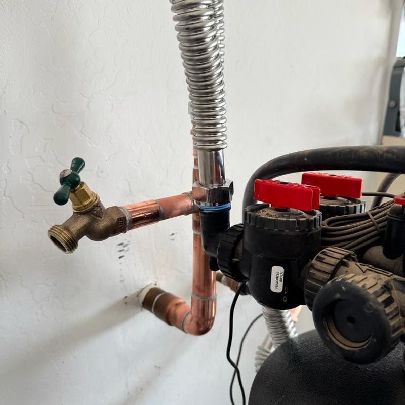 Water softener hose bib with copper piping and valves