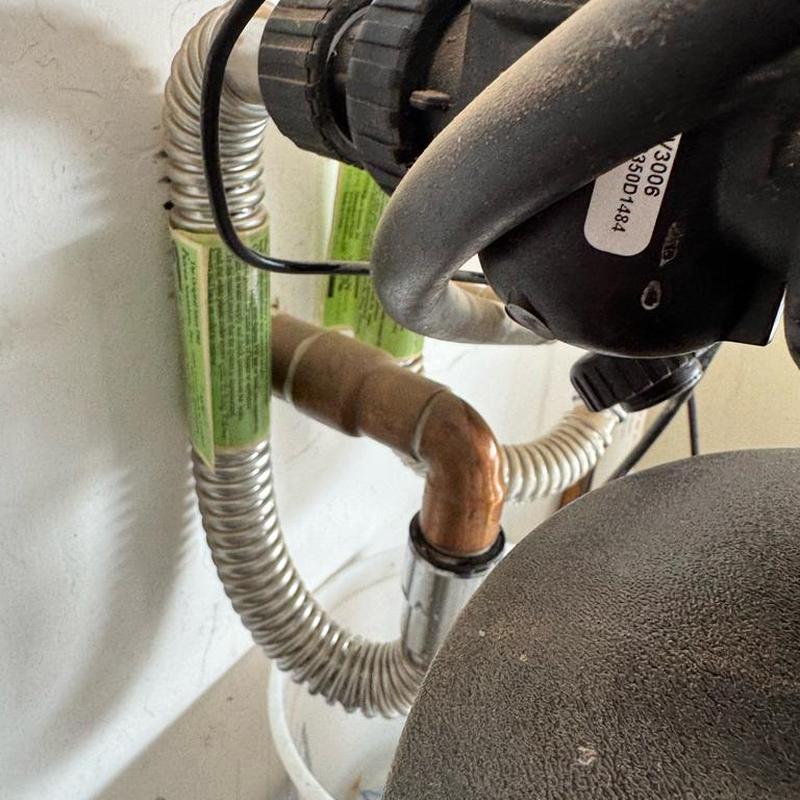 Water softener outlet hose bib with copper adapters