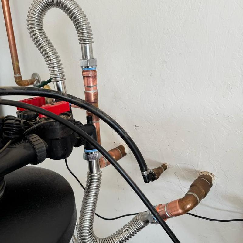 Water softener outlet with hose bib and copper pipes