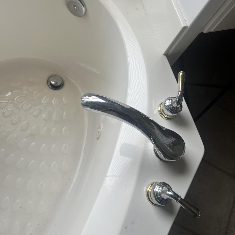 Jetted master bath tub faucet and handles close-up