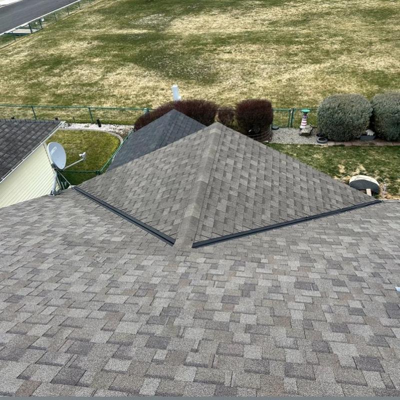 Ridge vent installation on asphalt shingle roof