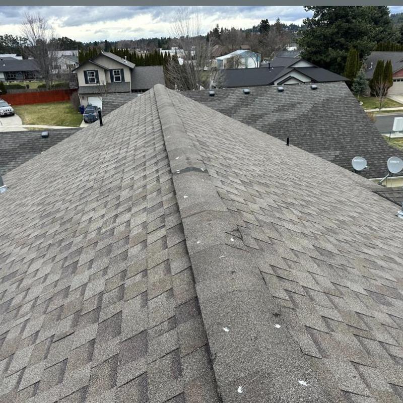 Ridge vent damage and asphalt shingle roof inspection