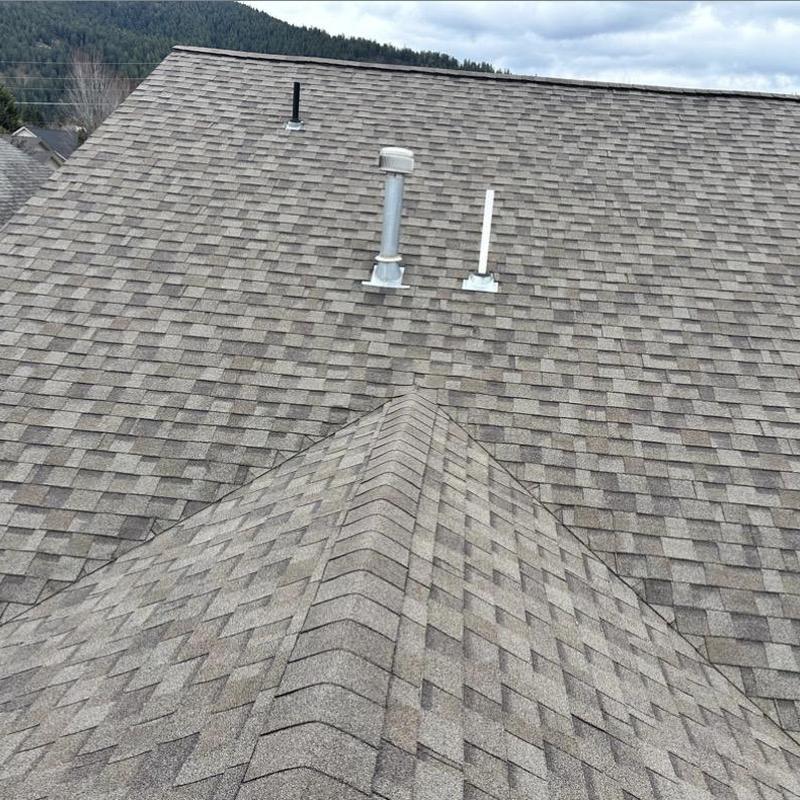 Ridge vent and shingle roof after windstorm repair