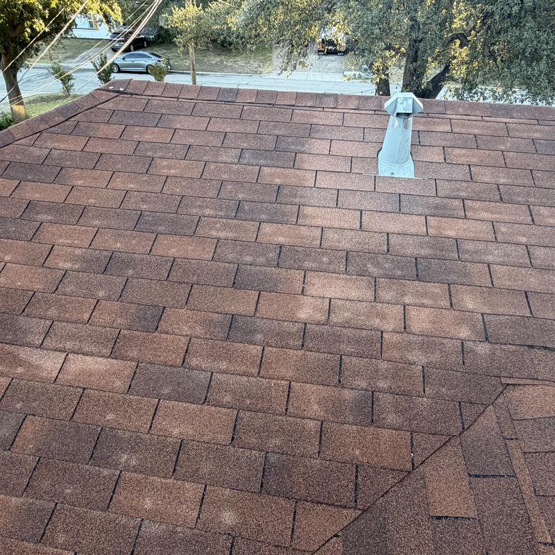 Asphalt shingle roof with vent pipe on residential home