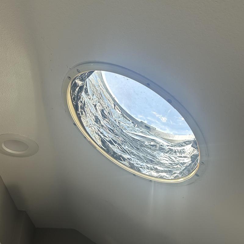 Solar tube with reflective interior installed in ceiling