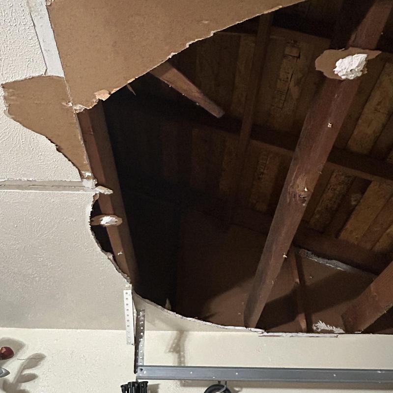 Sheetrock ceiling damage with exposed beams