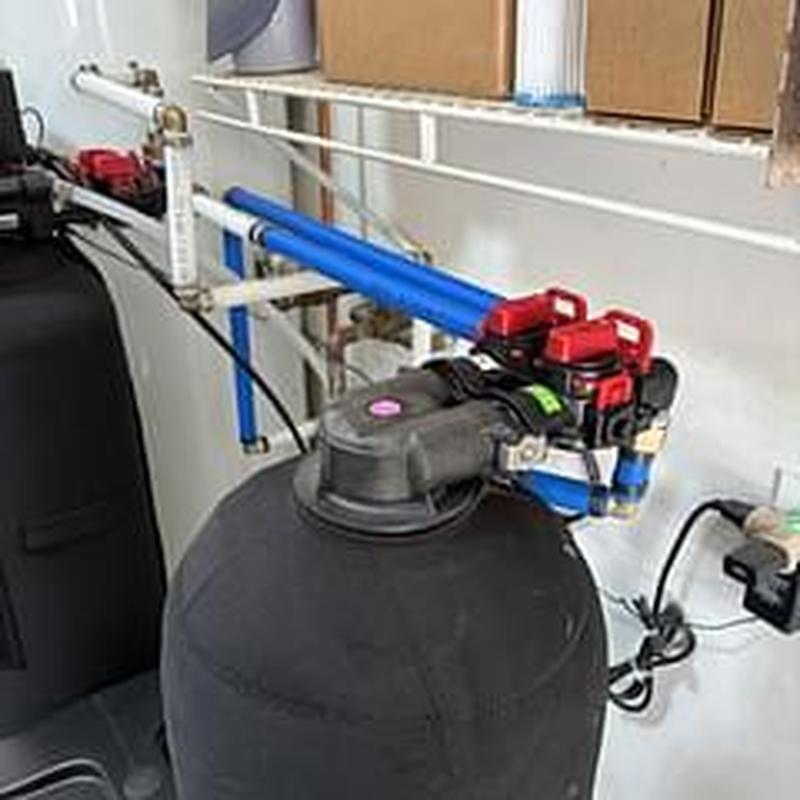 Water softener with inline customer filter installation